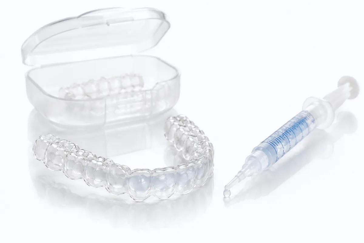 Custom whitening tray, case, and gel syringe for take-home teeth whitening